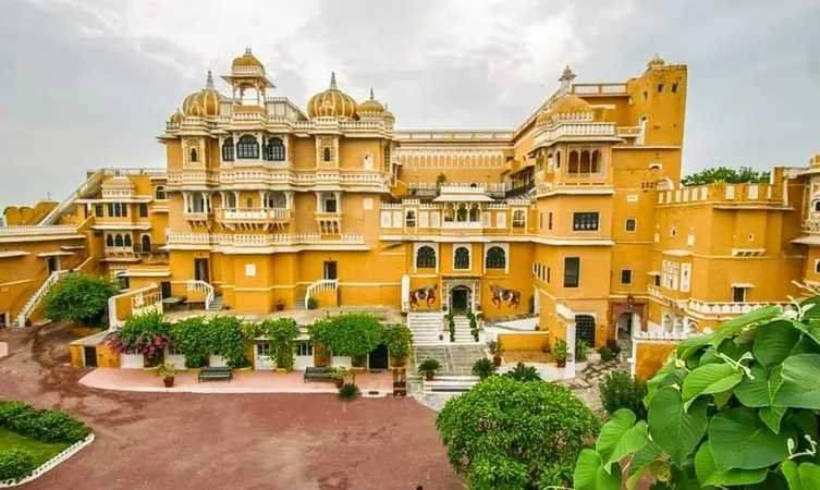 Large yellow Indian palace with domes and courtyards